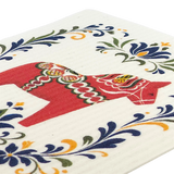 A red Dala horse with detailed patterns is surrounded by blue, yellow, and green floral designs on a white textured background.