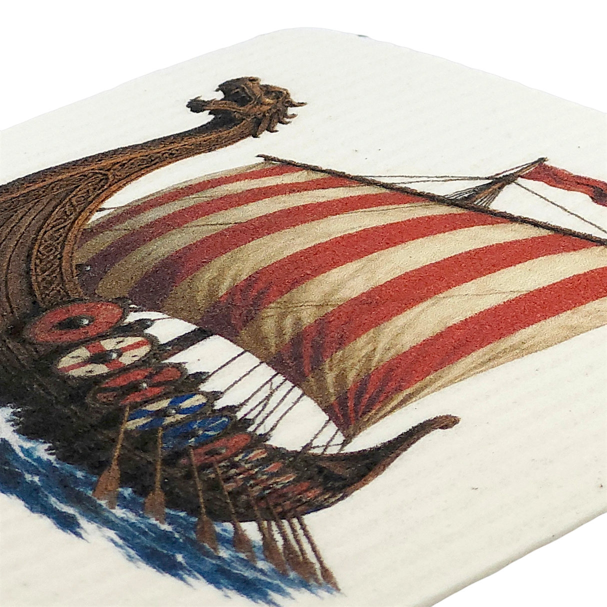Swedish dishcloth featuring a Viking longship with a red and white striped sail, dragon-shaped prow, round shields along the side, and oars.