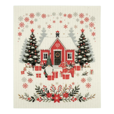 A Scandinavian-style dishcloth featuring a red house with snow, Christmas trees, gifts, a gnome, and a cat in a winter scene.