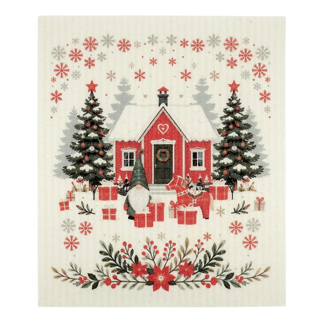 A Scandinavian-style dishcloth featuring a red house with snow, Christmas trees, gifts, a gnome, and a cat in a winter scene.