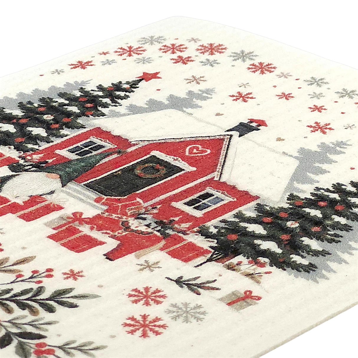 Eco-friendly dishcloth with a red house, snow-covered trees, wrapped gifts, and snowflakes in a Scandinavian winter design.