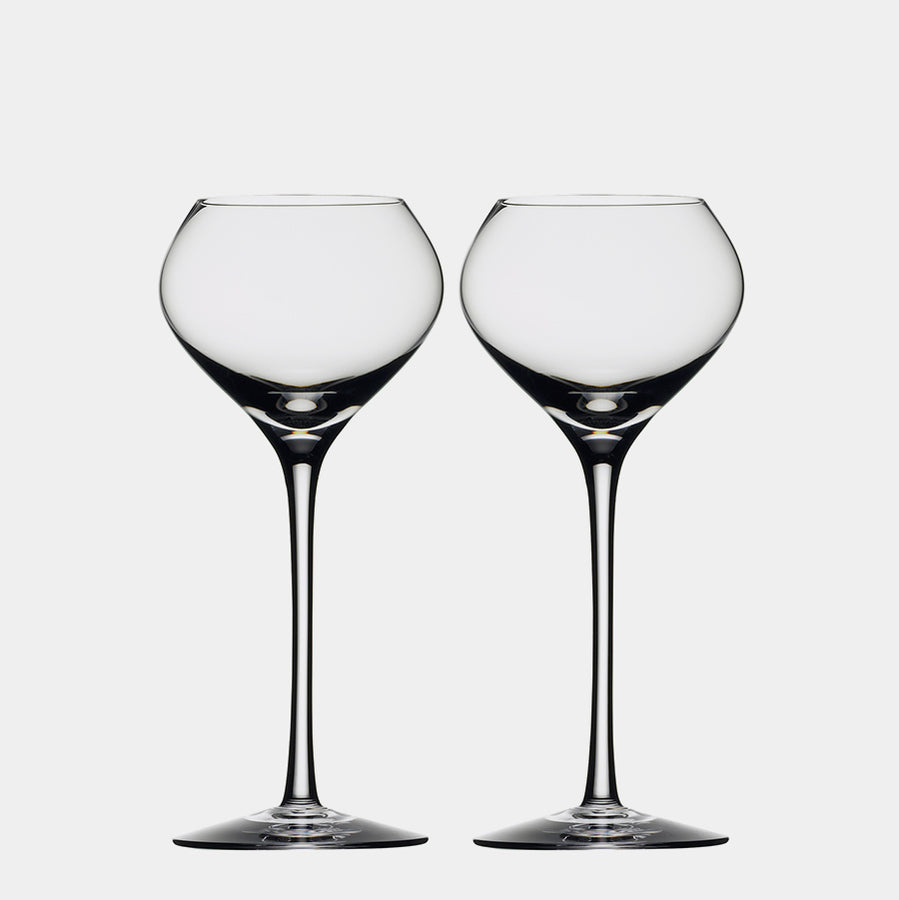 The Orrefors: Difference Sweet Glass 7.5oz (2-Pack), inspired by Erika Lagerbielke’s elegant style, showcases exquisite, mouth-blown artistry with long stems on a white background, perfect for enjoying delicate dessert wines and epitomizing sophistication and craftsmanship.