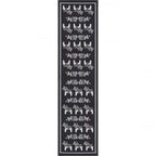 A black runner rug by Ekelund Master Weavers, named Siljan, showcases grey Swedish Dala horses on a black background, drawing from traditional motifs.