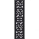 A black runner rug by Ekelund Master Weavers, named Siljan, showcases grey Swedish Dala horses on a black background, drawing from traditional motifs.