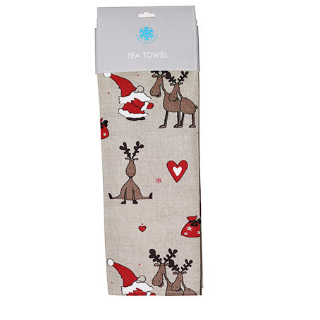 The Tea Towel: Reindeer & Tomte "Santa" Holiday Tea Towel is beige, features cartoon reindeer, Santa hats, red hearts, and a red sack. Made from a soft linen-cotton blend and packaged with a “Tea Towel” label decorated with a blue snowflake.