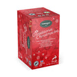 Red tea box decorated with white snowflakes and Finnish text, containing black tea flavored with cinnamon and cardamom.