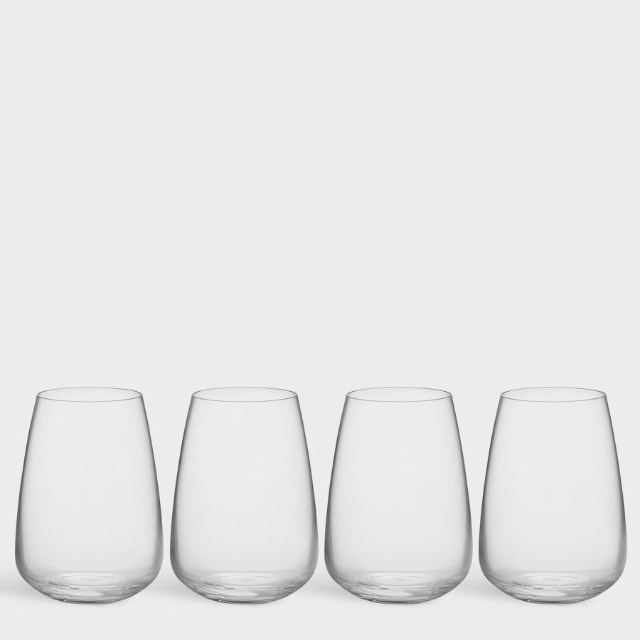 The Orrefors Pulse Tumbler Glass 4-Pack offers Scandinavian simplicity and timeless sophistication with four clear, stemless glasses exuding understated charm.