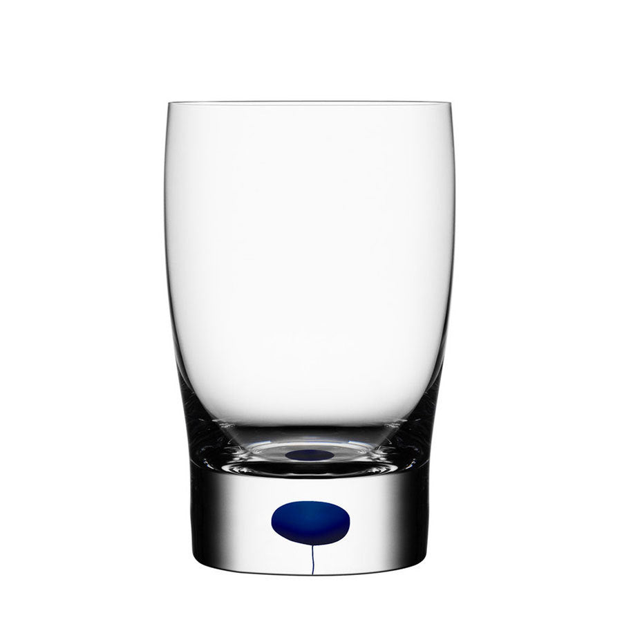 The Orrefors Intermezzo Blue Tumbler/Juice 9oz (2-Pack), crafted by Erika Lagerbielke, features clear glass with a thick base and a striking blue accent at the center, displayed on a plain white background.