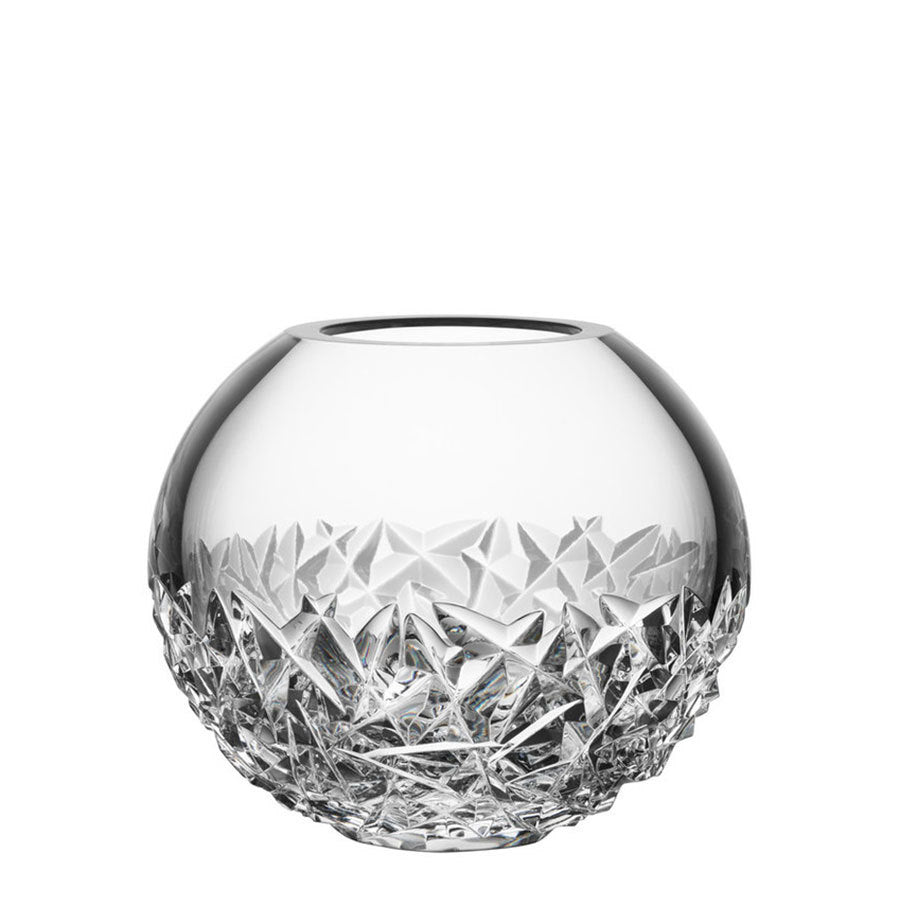 The Orrefors: Carat Globe Vase Large is a crystal creation with geometric faceted patterns on the bottom half that intricately reflect light.