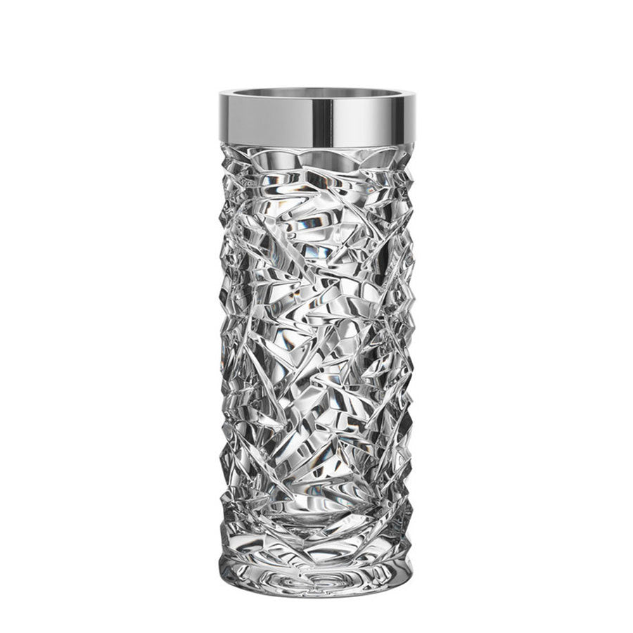 The Orrefors Carat Vase by Lena Bergström is a tall, transparent crystal glass piece with intricate patterns and a reflective silver rim.