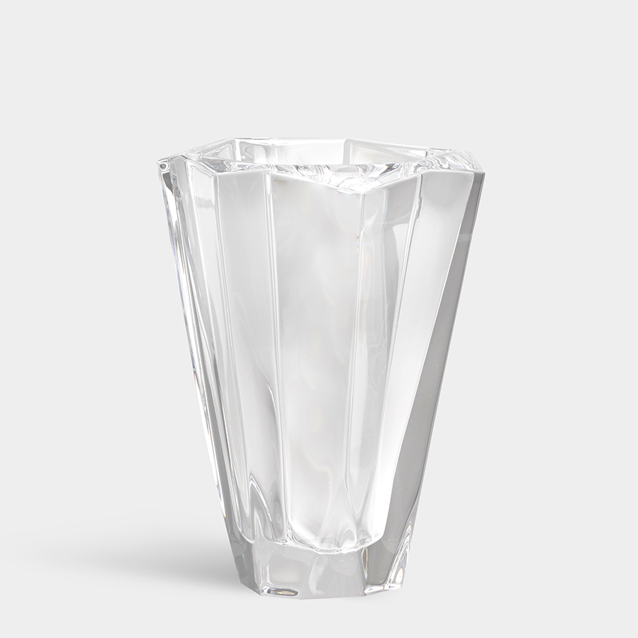 The Orrefors: Precious Vase Small, crafted with an angular, geometric design, sits elegantly against a plain gray background.