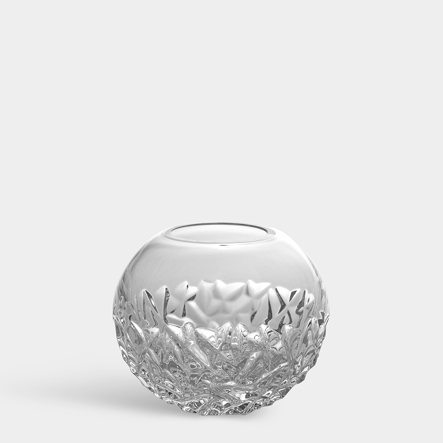 The Orrefors: Carat Globe Vase Small is an exquisite crystal glass piece, featuring intricate cut patterns at the base and set beautifully against a plain white background.