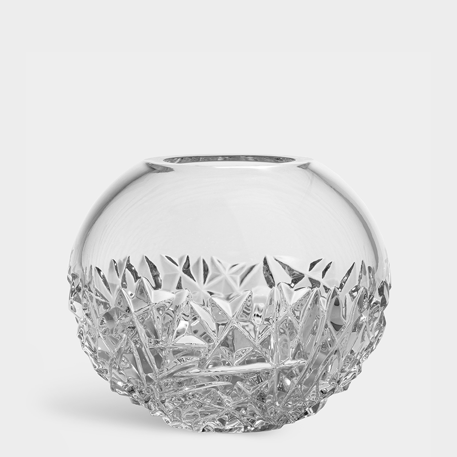 The Orrefors Carat Globe Vase Large is an exquisite round bowl crafted from clear crystal glass, featuring intricate geometric patterns on the lower half.