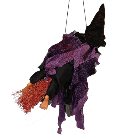 The Walburga Purple Kitchen Witch Doll, dressed in a black hat and purple outfit and holding a broomstick, makes a charming piece of folklore décor against the white background.