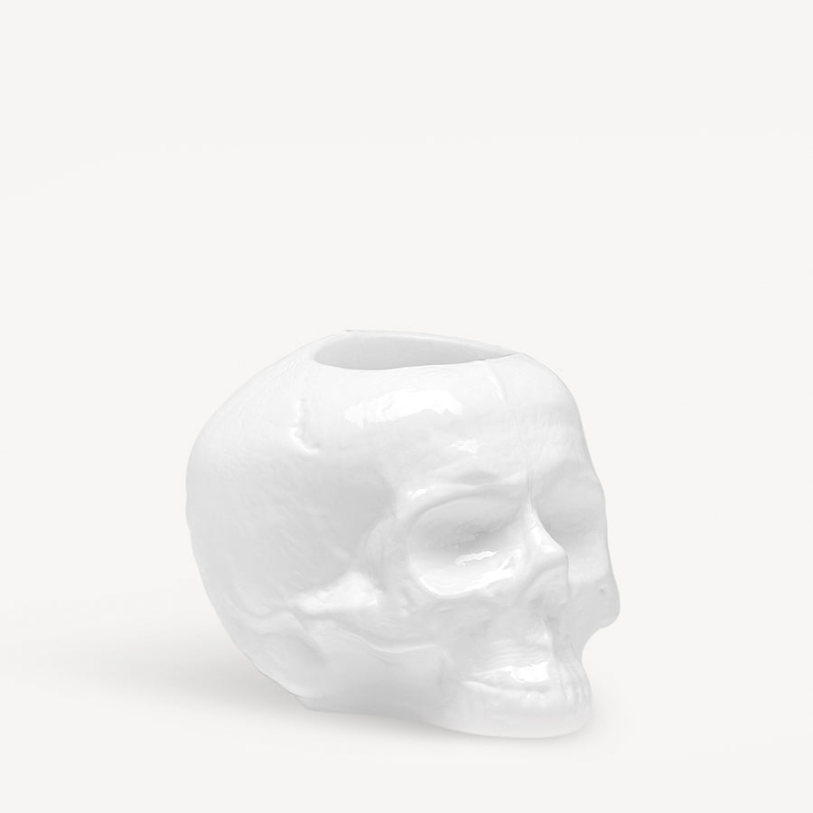 KostaBodas Skull-shaped Still Life Votive Candle Holder in white ceramic, set against a plain background.