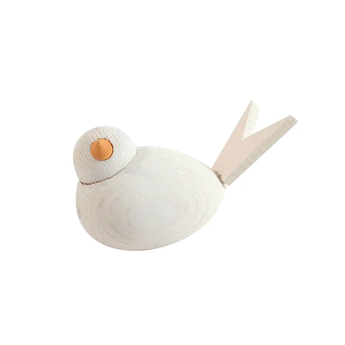 A 2.5" long, minimalist Swedish handcrafted wooden bird figurine from the "Figurine: Swedish Handcrafted Wooden Birds (Red, White, and Blue)" collection, featuring a white body, orange eye, and V-shaped tail for timeless appeal.