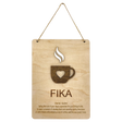 Wooden plaque with a steaming cup cutout, heart detail, and the word “FIKA” in bold letters, referencing the Swedish coffee break tradition.