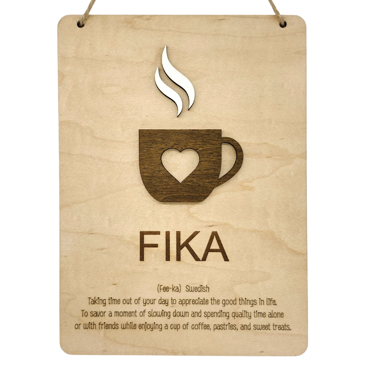 Wooden wall plaque with a coffee cup and heart cutout, labeled FIKA in bold letters. Scandinavian design elements visible.