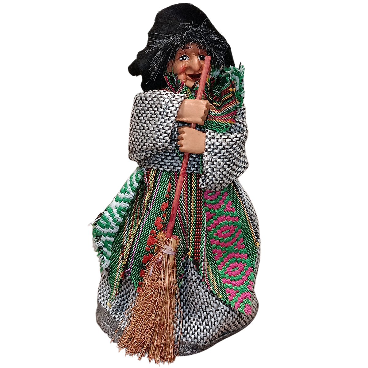 The Yasmina Green Kitchen Witch Doll is a 7" tall handmade figurine featuring an elderly woman with a black headscarf, colorful dress, shawl, and twig broom—ideal for kitchen protection. Standing base included. Made in Germany.