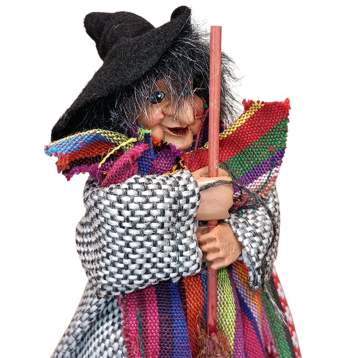 The Kitchen Witch: Yasmina Purple Standing Kitchen Witch Doll, dressed in a black hat, colorful shawl, and checkered coat holding a broomstick, is a charming Scandinavian-inspired protective talisman on a white background.