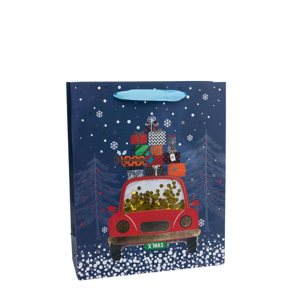 The Gift Bag: Holiday Car Sequin Medium Gift Bag Christmas features a red car with an XMAS plate overflowing with presents in a snowy scene. Surrounded by trees and snowflakes, this Christmas-themed gift bag brings sparkle to your holiday celebrations.