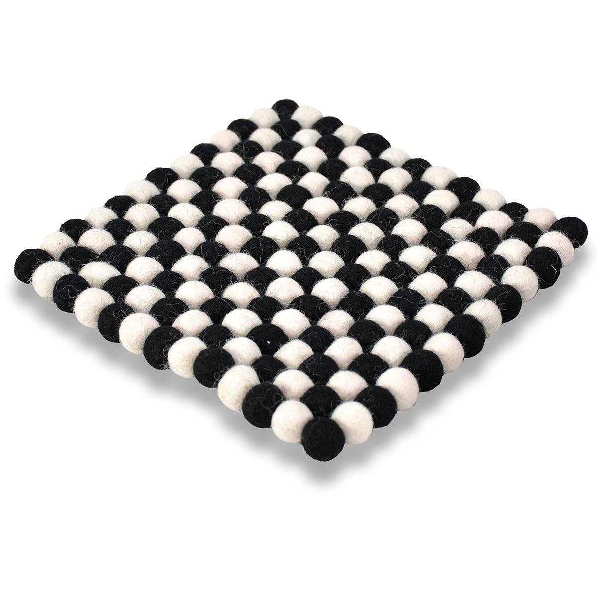 The Square Pom-pom Trivet: Black & White is handcrafted with alternating felt balls in a grid pattern, ideal for protecting your dining table.