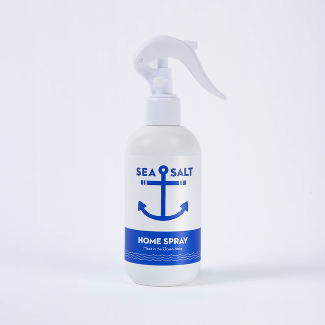 A white spray bottle labeled Home Fragrance: Swedish Dream® Sea Salt Home Spray 8 fl oz, featuring a blue anchor graphic and “Made in the Ocean State,” offers an ocean air scent. This cruelty-free product is shown on a white background.