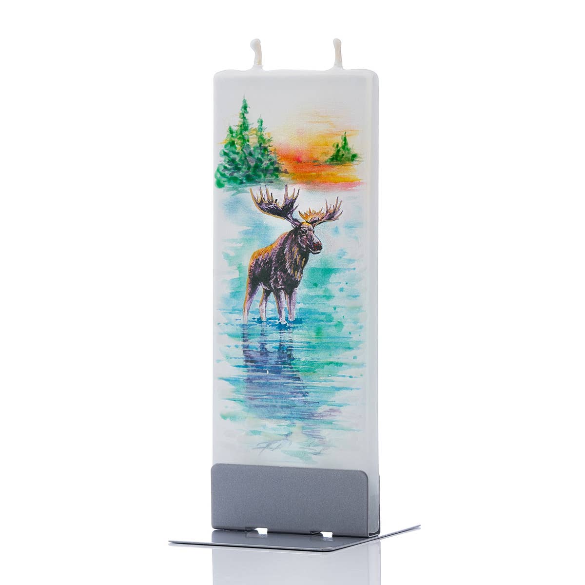 The Candle: Moose by the By The Lake - Flat Candle showcases a hand-painted scene depicting a moose standing in water, encircled by trees and a sunset. This handmade, rectangular candle includes twin wicks for an even glow and is elegantly displayed on a silver stand.