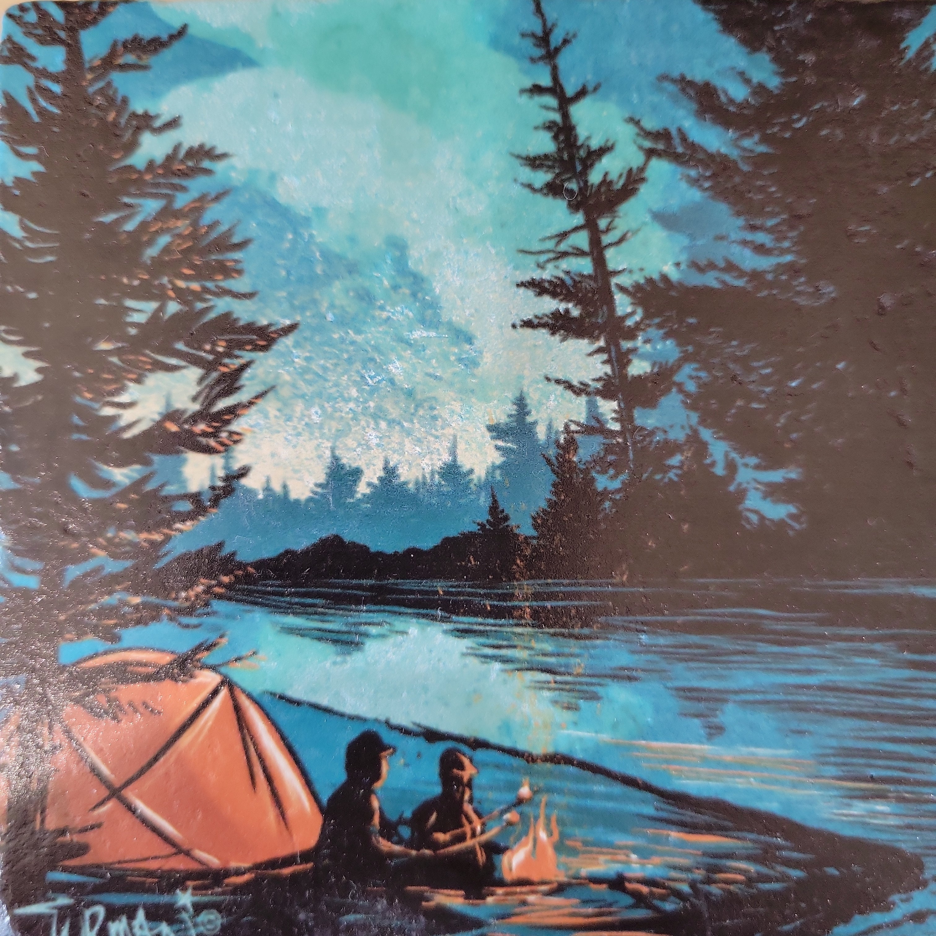 Two people sit by a campfire near an orange tent and lake, surrounded by trees under a blue sky—a cozy Minnesota camping scene captured on the S'mores Campfire Coaster by Adam Turman.