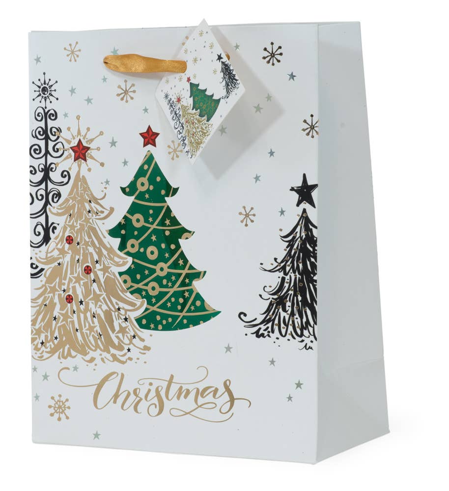 The Gift Bag: Christmas Tree Foil Bag Large is a large white Christmas gift bag featuring decorated Christmas trees, stars, and snowflakes. Its festive design is completed with a gold ribbon and tag.