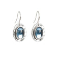 A&C Oslo Silver Deep Blue Hanging Earrings feature blue oval gemstones in raised bezels with simple hooks, inspired by modern Scandinavian design.