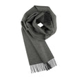 The 100% Baby Alpaca Scarf in Carbon (Charcoal) is shown folded with fringed ends on a white background, highlighting its soft texture and unisex appeal for any wardrobe.