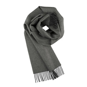 The 100% Baby Alpaca Scarf in Carbon (Charcoal) is shown folded with fringed ends on a white background, highlighting its soft texture and unisex appeal for any wardrobe.