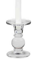 A glass dual-size candle holder (5") beautifully showcases a white taper candle, emitting a warm glow.
