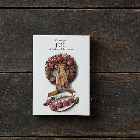 A Card Pack: Jul - A taste of Christmas by Koustrupco, featuring 8 festive cards and envelopes with different images, is perfect for gifting or pairing with Scandinavian Christmas cards.