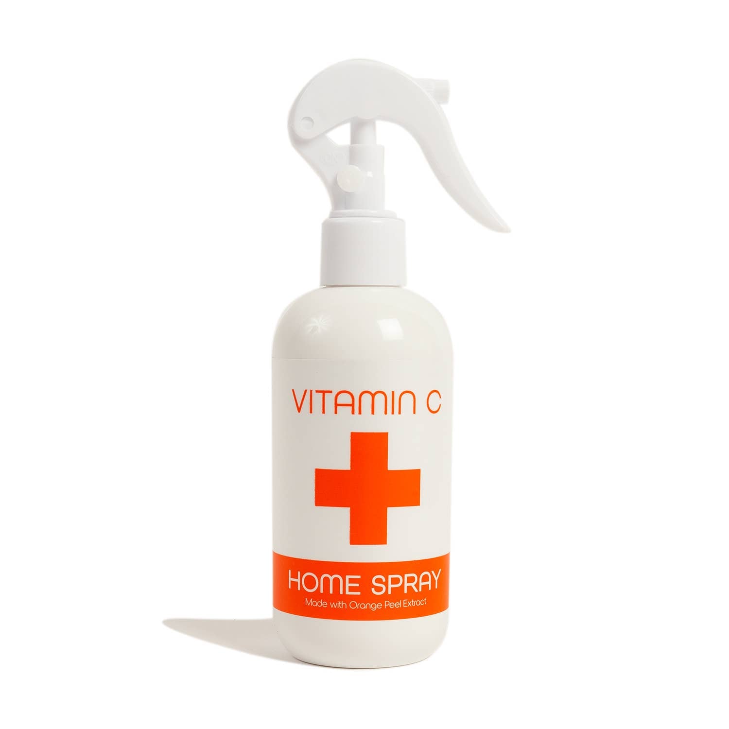 The Nordic+Wellness™ Vitamin C Home Spray, a white plastic bottle adorned with the VITAMIN C HOME SPRAY label and a red cross symbol, is crafted using orange peel extract. Experience the refreshing citrus scent that evokes the essence of freshly squeezed oranges.