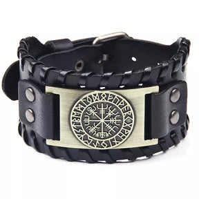 The Bracelet: The Viking Compass Vegvisir features black leather with braided edges, metal rivets, and a central rectangular plate showcasing the Norse Vegvisir runic compass—an eye-catching piece of Norse mythology jewelry.