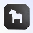 A black cast iron trivet features a white silhouette of a Swedish Dala Horse.