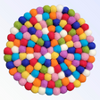 Multi-Color Round Wool Felted Pom-Pom Trivet features a handcrafted design with vibrant, closely packed wool felt balls arranged in a symmetrical pattern.