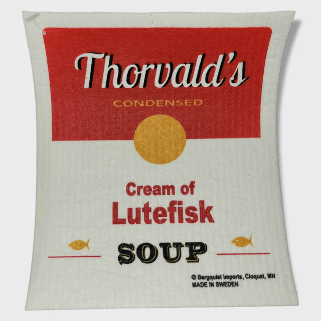 Thorvalds Cream of Lutefisk Soup Swedish Dish Cloth features a red, white, and yellow design akin to its iconic packaging. Highlighting tradition with Made in Sweden, it presents an eco-friendly choice for culinary enthusiasts.