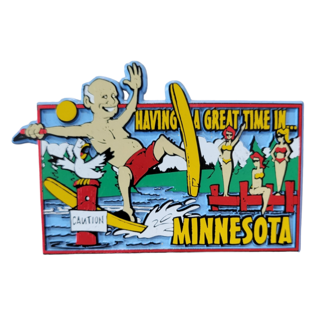 A vibrant depiction of a man waterskiing alongside a seagull, enveloped by water and women sunbathing, featuring the text: Having a Great Time in Minnesota. Product: Magnet: Having a Great Time in MN.