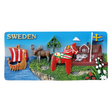 The Magnet: Swedish Images on Refrigerator Magnet 3-Dimensional radiates Scandinavian charm, showcasing a Viking ship, moose, red Dala horse, traditional house, and Swedish flag. SWEDEN graces the top left corner, making it an authentic souvenir.