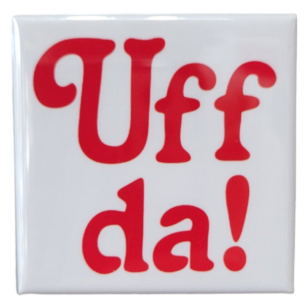 The 2” Uff Da Magnet is a square metal magnet showcasing "Uff Da!" in large, bold, red letters. It's perfect for adding a touch of fun and character to your kitchen decor when used as a refrigerator magnet.