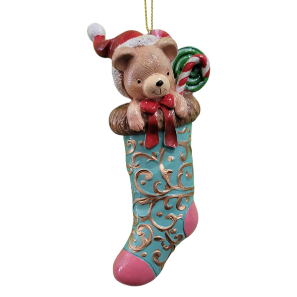The "Ornament: Christmas Stocking" features a bear in a Santa hat peeking out, complete with a candy cane, adding to the holiday décor.