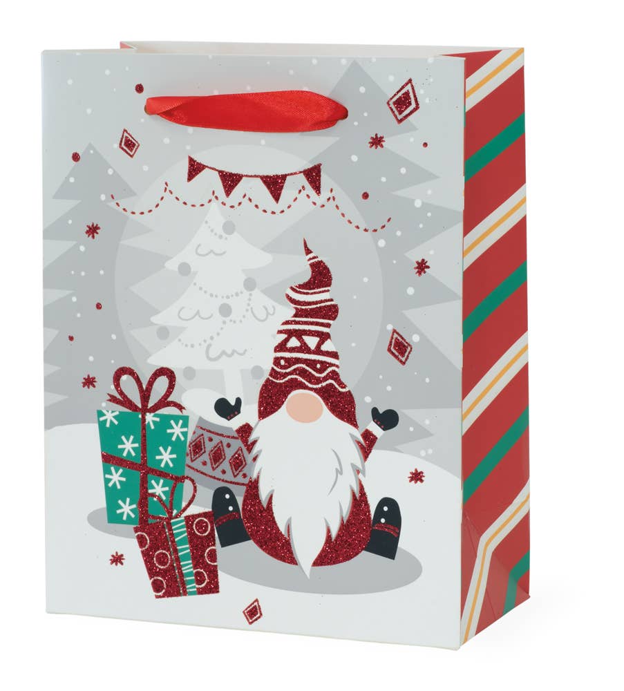 The "Presents Gnome Christmas Bag Small" showcases a festive design with an adorable gnome wearing a red hat, surrounded by wrapped gifts and snowflakes. Crafted from high-quality paper materials, it also features side stripes in red, green, and white.