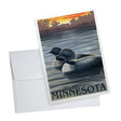 The "Cards: Minnesota Loons" Valentine's Day card showcases two loons on a tranquil lake with a gorgeous sunset backdrop, capturing the peaceful romance of Minnesota. The word "Minnesota" is elegantly displayed at the bottom, and it comes with an envelope ideal for sending your love like a modern-day Viking woman.