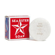 A round white bar of Sea Aster Soap - Swedish Dream 4 oz sits beside its red, star-designed box featuring the same text, showcasing this calming soap.