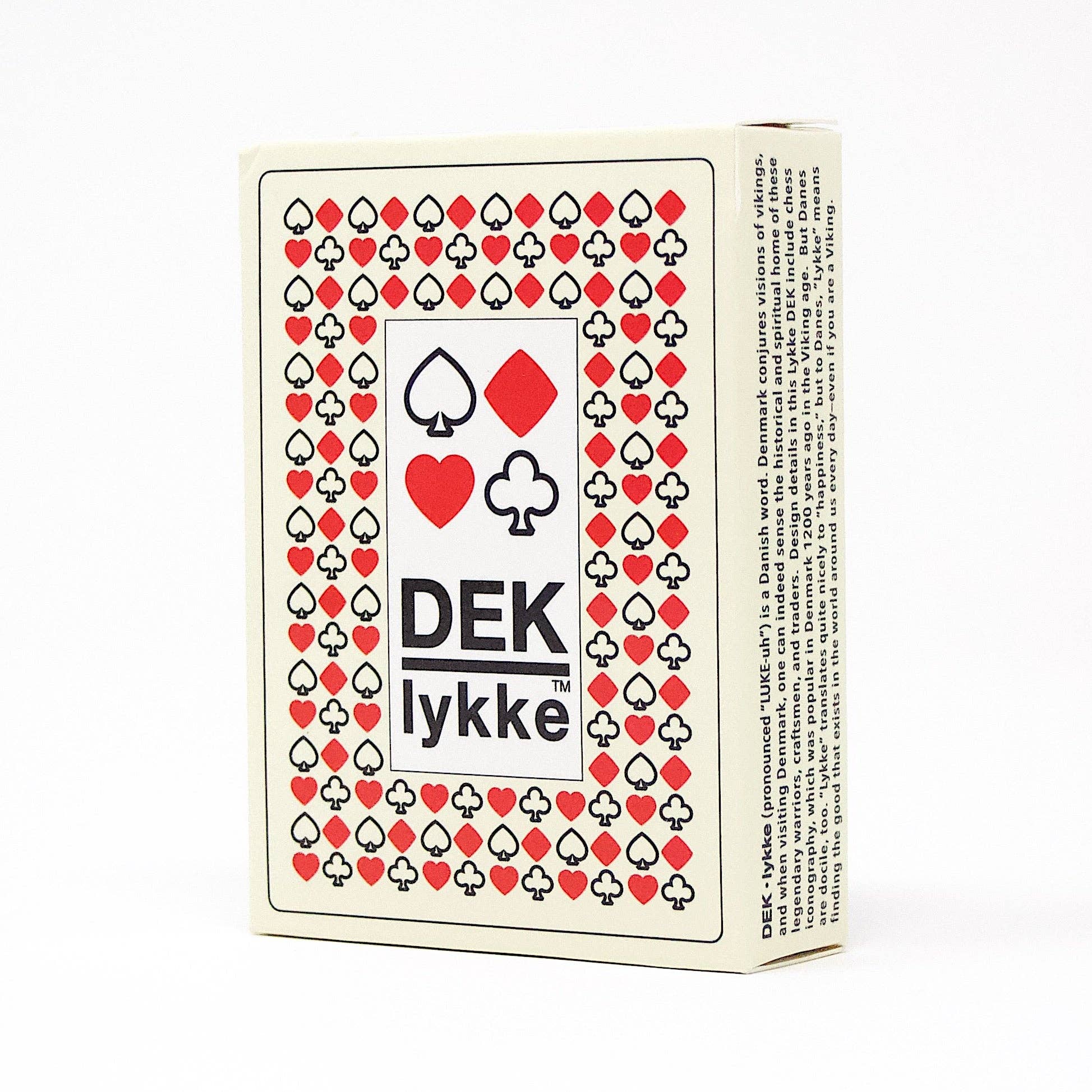 Card deck packaging featuring red and black suit designs, labeled as Playing Cards: DEK Lykke (Denmark), which embodies the joy in every shuffle.