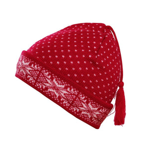 A red wool beanie by Norlender Knitwear, featuring a delightful white snowflake design and a playful tassel on top.