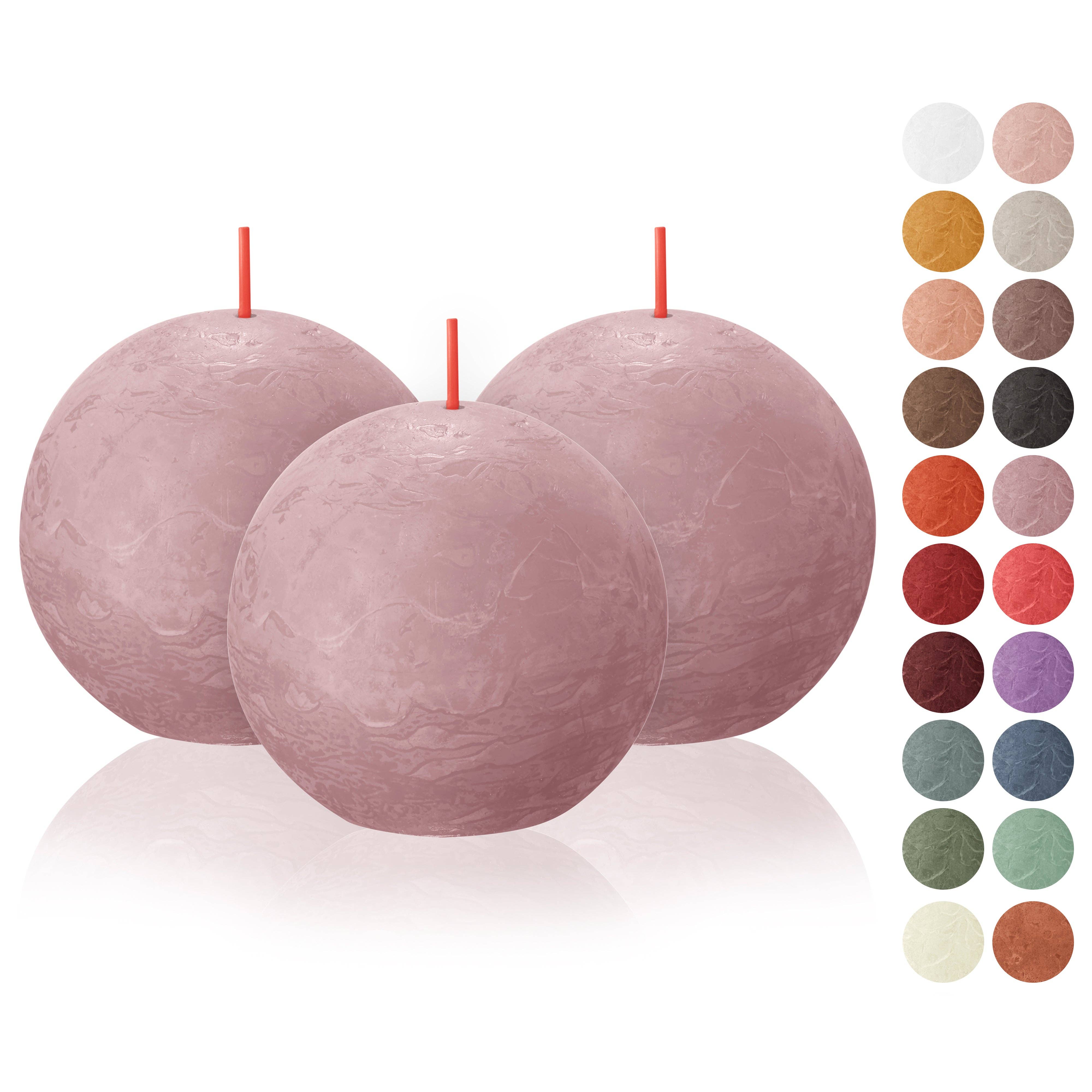 Three Ash Rose Rustic 3" ball candles, featuring red wicks and crafted from plant-based wax, in a pastel pink hue are displayed amidst samples of various other colors.